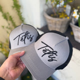 A cap TĒTIS