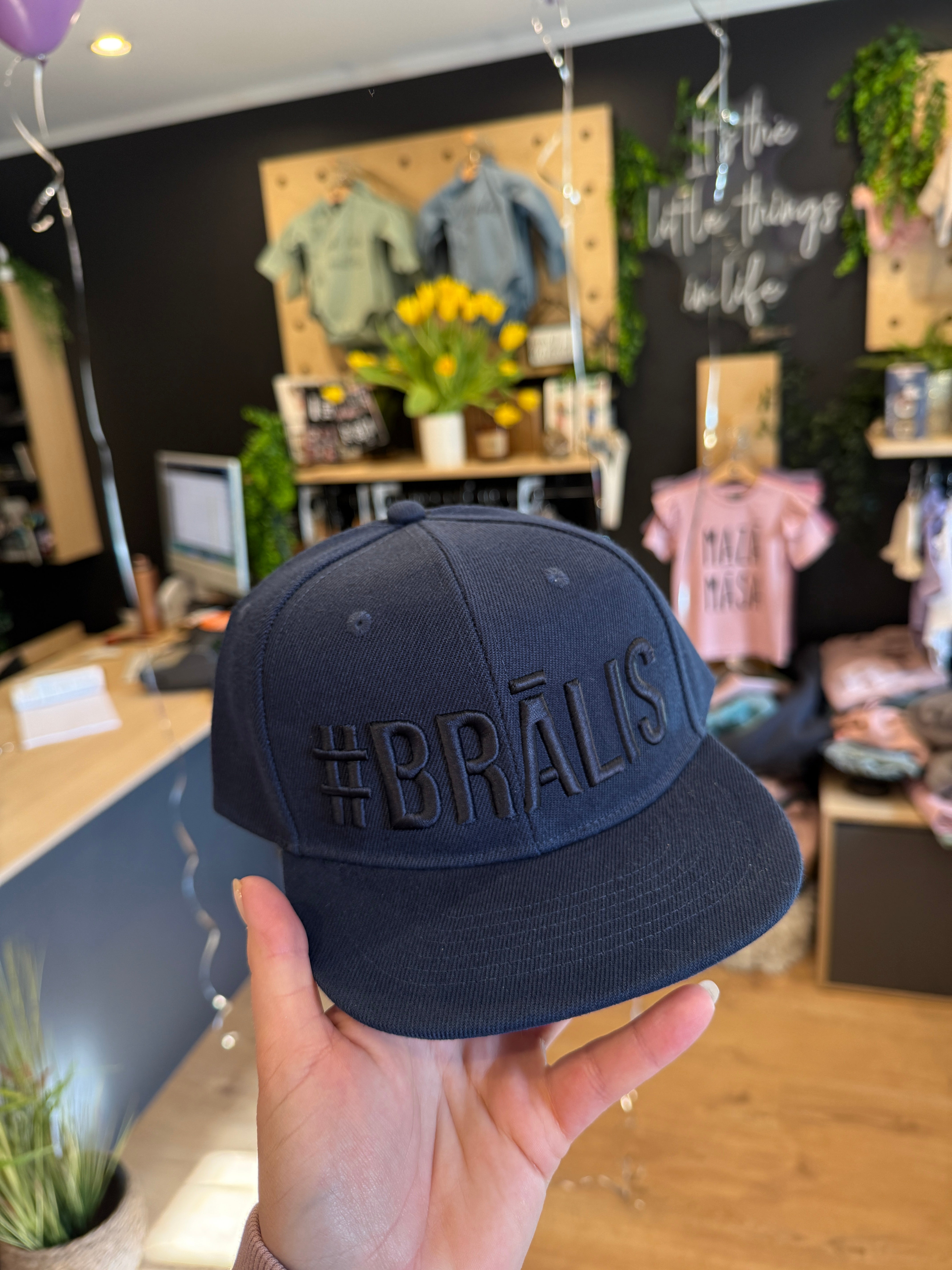 A cap #BRĀLIS or #MĀSA