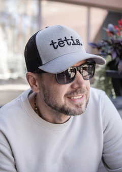 A cap TĒTIS.